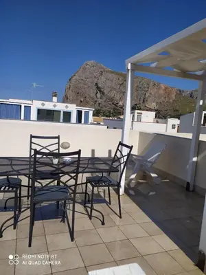 a group of chairs and a table on a patio at Il Peperoncino in San Vito lo Capo