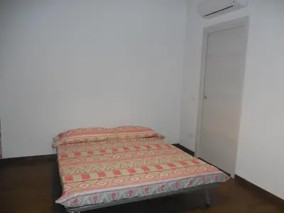 a couch sitting in the corner of a room at Il Peperoncino in San Vito lo Capo