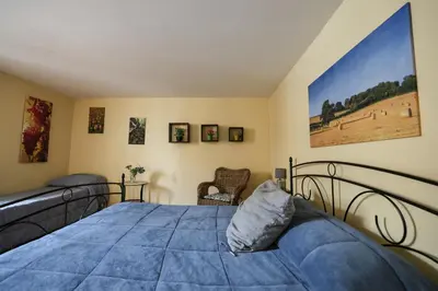 a bedroom with two beds and a large blue bed at Antica Dimora in Palermo
