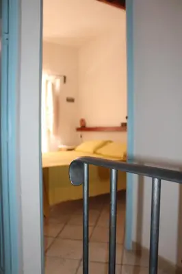 a view of a room with a bed in the background at Soleluna in Castellammare del Golfo
