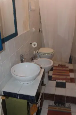 a bathroom with a sink and a toilet at Soleluna in Castellammare del Golfo