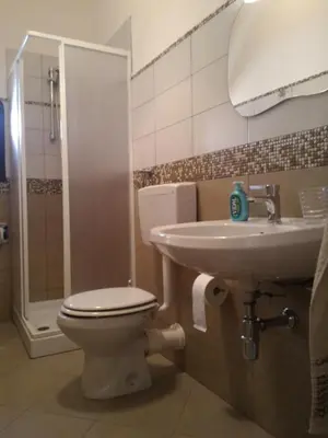 a bathroom with a toilet and a sink at I due Archi in Castellammare del Golfo