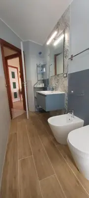 a bathroom with two sinks and a tub and two sinks at La perla della Conca d'Oro in Palermo