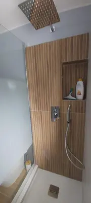 a bathroom with a shower with a shower head at La perla della Conca d'Oro in Palermo