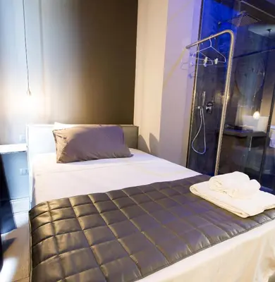 a bed with a shower and towels on it at Dimora Villareale in Palermo