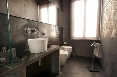 a bathroom with a sink and a toilet at Dimora Villareale in Palermo