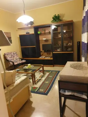 a living room with a couch and a table at Lunetta in Palermo