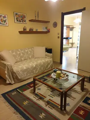 a living room with a couch and a coffee table at Lunetta in Palermo
