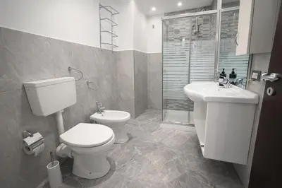 a bathroom with a toilet and a sink at A Mare Appartamenti in Castellammare del Golfo