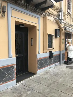 a man taking a picture of a door of a building at Apartment Co in Palermo