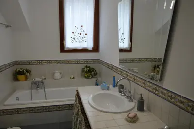 a bathroom with a sink and a bath tub at Villa Matilde in Carini
