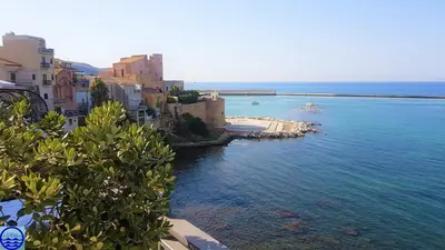 a view of a body of water with buildings at Casa Trio Apartments in Castellammare del Golfo