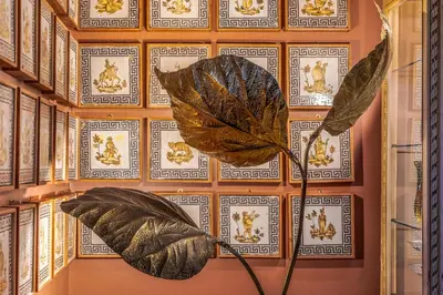 a large leaf sculpture on a wall in a room at Le Stanze al Genio di Darlon in Palermo