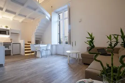 a living room with a couch and a table at Politeama Apartments by Giorgio in Palermo