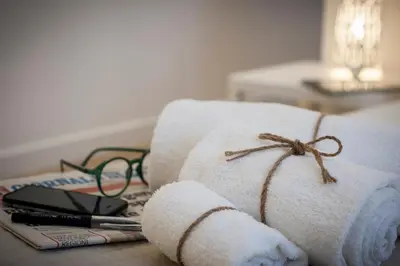 a pile of towels sitting on top of a table at Politeama Apartments by Giorgio in Palermo