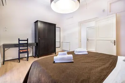 a bedroom with a bed with two white pillows on it at Casa Nonna Toto in Palermo