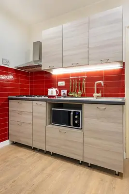 a kitchen with a sink and a microwave at Casa Nonna Toto in Palermo