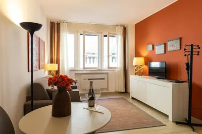a living room with a vase of flowers on a table at Loggiato 261 Palazzo San Matteo in Palermo