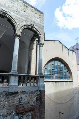 a building with two arches on the side of it at Loggiato 261 Palazzo San Matteo in Palermo