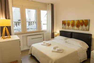 a bedroom with a bed with two towels on it at Loggiato 261 Palazzo San Matteo in Palermo