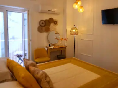 a living room with a couch and a table at Atrium in Castellammare del Golfo