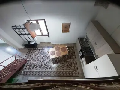 an overhead view of a kitchen with a table and a stove at Nelle Antiche Mura in Castellammare del Golfo