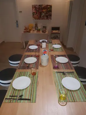 a group of tables with white plates on them at B&B Ponticello in Palermo