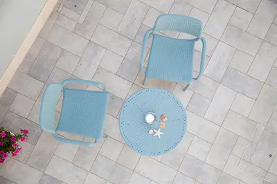 an overhead view of two blue chairs and a table at B&B Kolors in Castellammare del Golfo