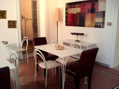 a dining room with a table and chairs at Palermo Centrale in Palermo