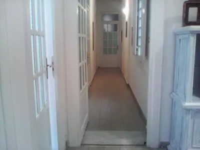 a hallway with two white doors and a tile floor at Palermo Centrale in Palermo