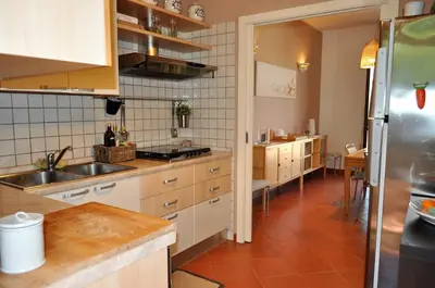 a kitchen with a sink and a refrigerator at casa Francy in San Vito lo Capo