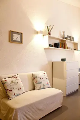 a living room with a couch with two pillows at Villa Tramonto in Macari