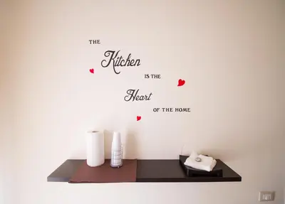 a shelf with the kitchen is the heart of the home wall sticker at La Cubba in Palermo