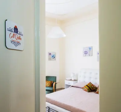 a small bedroom with a bed and a window at La Cubba in Palermo