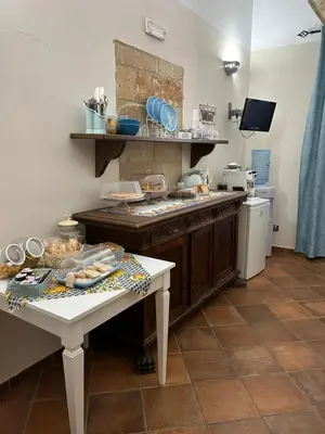 a kitchen with a table with food on it at B&B Cinisi Vacanze in Cinisi