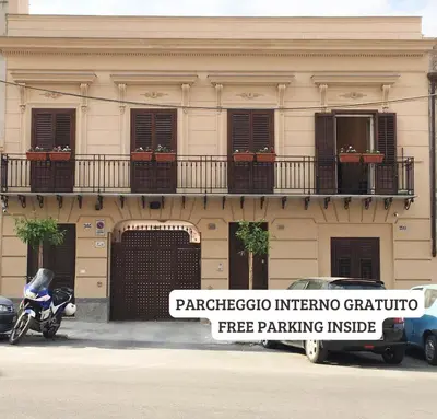 a motorcycle parked in front of a building at 301B&B in Palermo