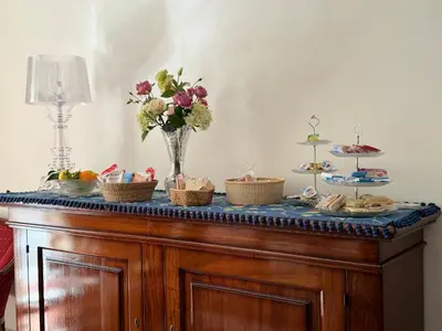 a table with baskets of food and flowers on it at 301B&B in Palermo
