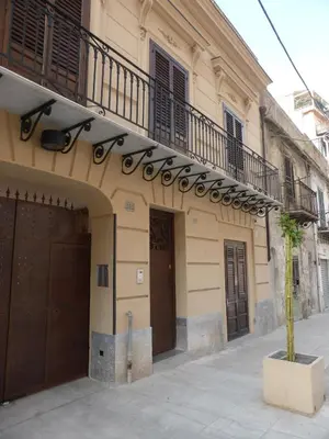 a building with a balcony on the side of it at 301B&B in Palermo