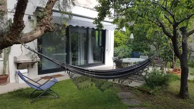 a hammock in the yard of a house at Nel Giardino degli Agrumi in Palermo