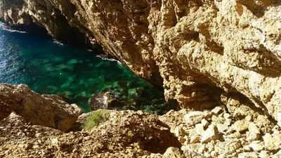 a view of the ocean from a rocky cliff at Villa lo Iacono in Terrasini