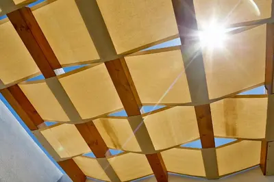 a wooden ceiling with a sun shining through it at Verdemare in Cefalù