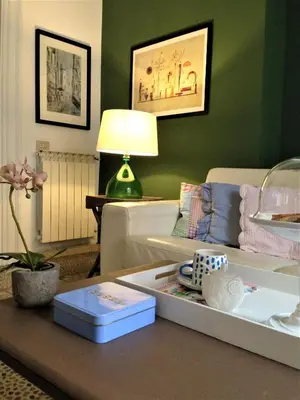 a living room with a couch and a table at A Casa di Amelie in Palermo
