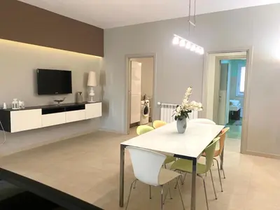 a living room with a white table and chairs at Villa Ruffino in Balestrate