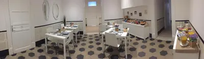 a room with three sinks in a room with at L'Opera Buffa in Palermo