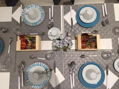 an overhead view of a table with plates of food at L'Opera Buffa in Palermo