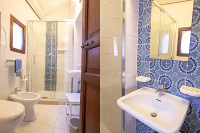 a bathroom with a sink and a toilet at Case di Maria in Castellammare del Golfo
