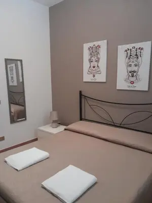a bedroom with a bed with two pillows on it at Casa Vacanze Chiara in Terrasini