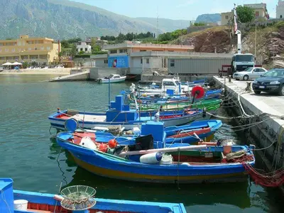 a group of boats are docked in the water at Casa Vacanze Chiara in Terrasini