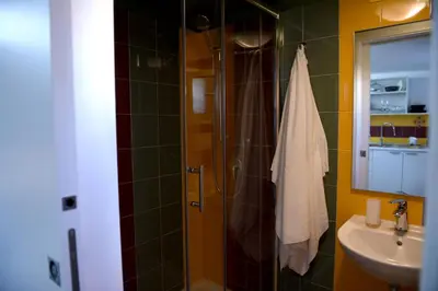 a bathroom with a shower and a sink at Chic Apartment Le Monde in Castellammare del Golfo