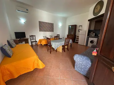 a living room with a bed and a dining room at Art Lincoln in Palermo